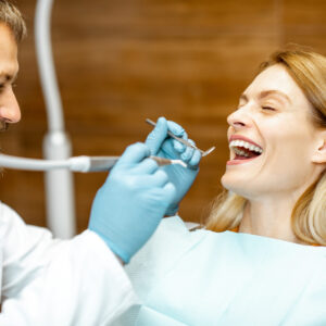 adult patient with dentist smiling during a medical consultation