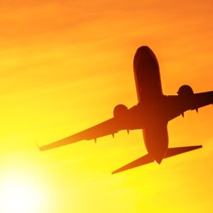 airplane taking off in the sun